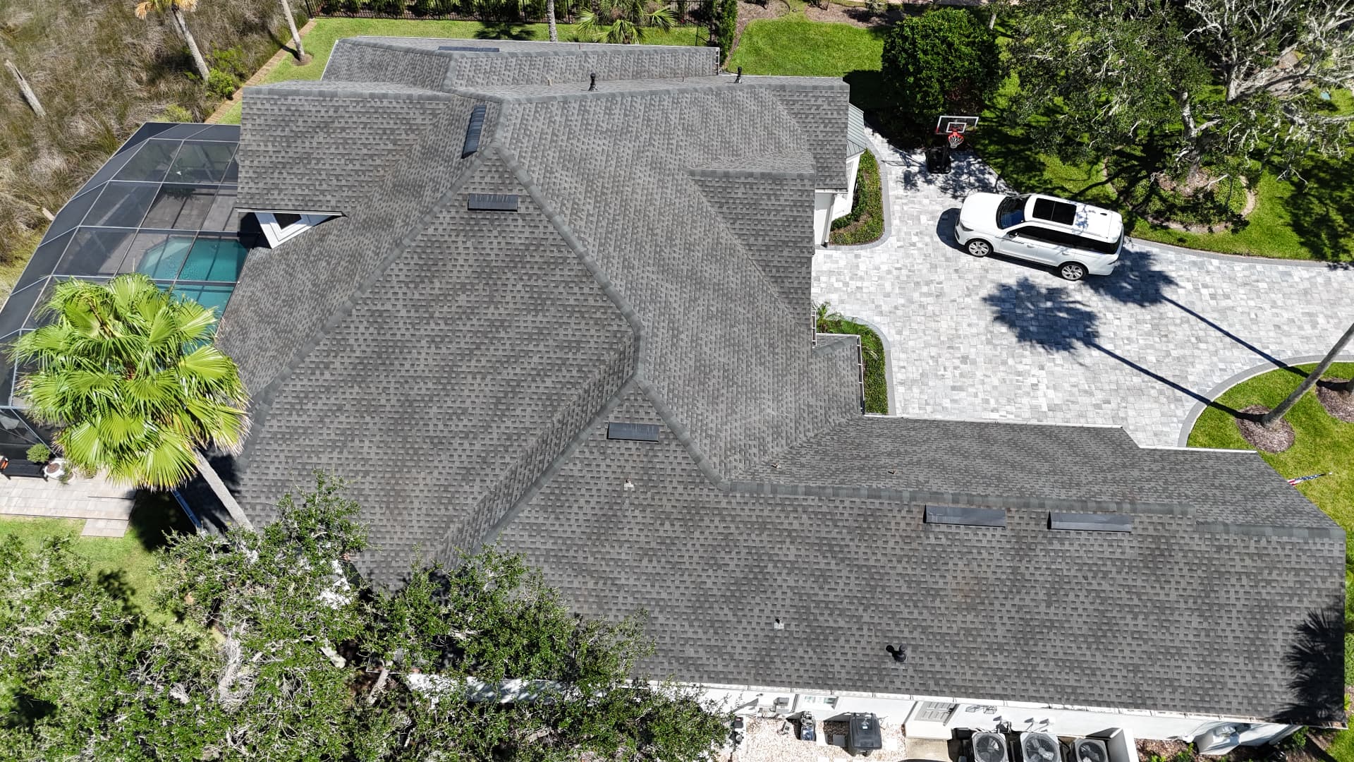 Roof after cleaning — restored light gray shingles